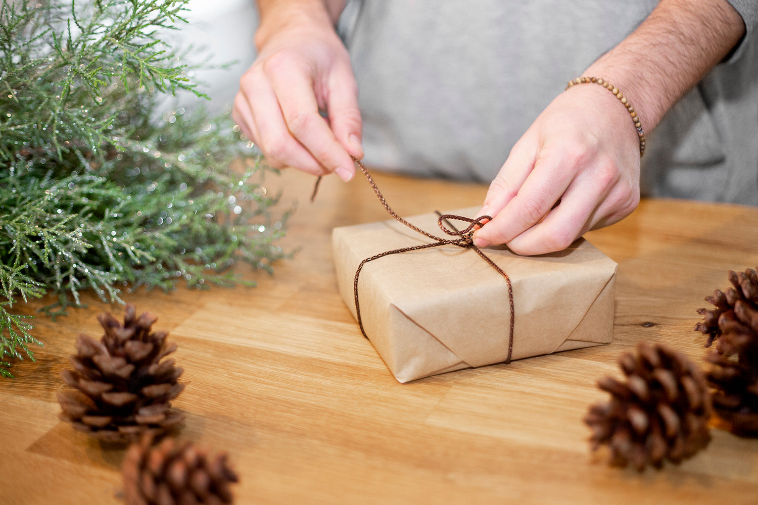 a-christmas-package-being-wrapped - Nav Konst